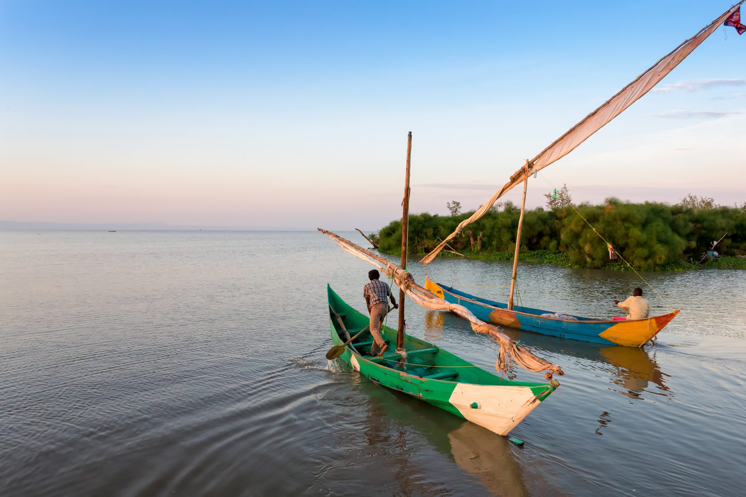 Lake victoria fishermen go to the robot and on the shore they are waiting for women