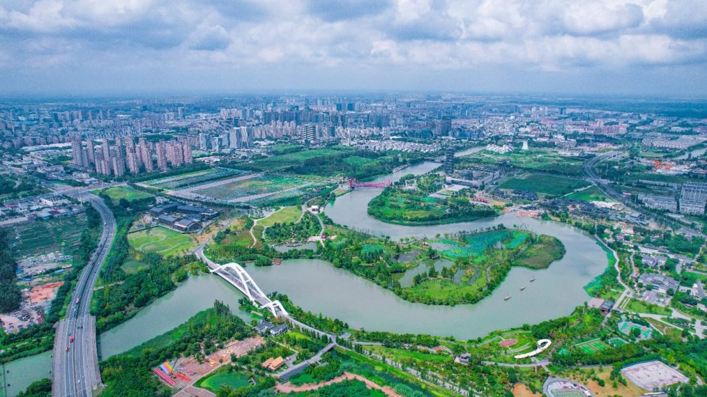 Aerial view of a canal winding through a city